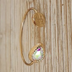 Gold bracelet with gem and T initial, $8